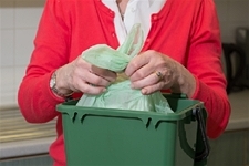 Once your liner is full, tie a knot in the top, and remove bag