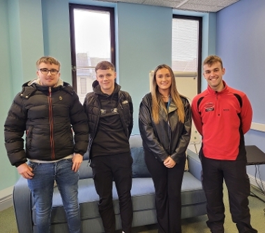 Three of our modern apprentices and one of our community wardens standing in the safer communities team office 